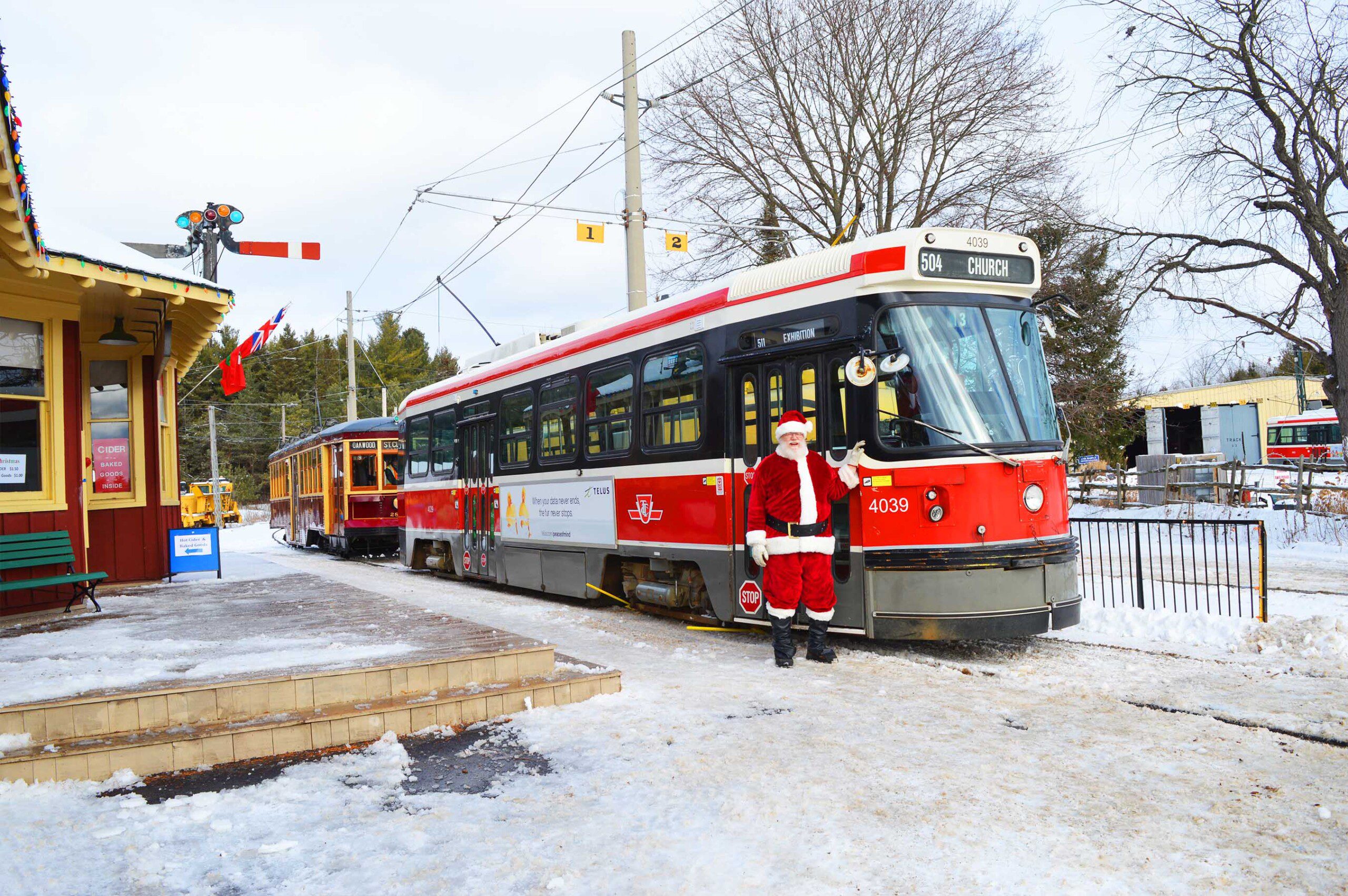 Christmas on the Rails image of streetcar and Santa